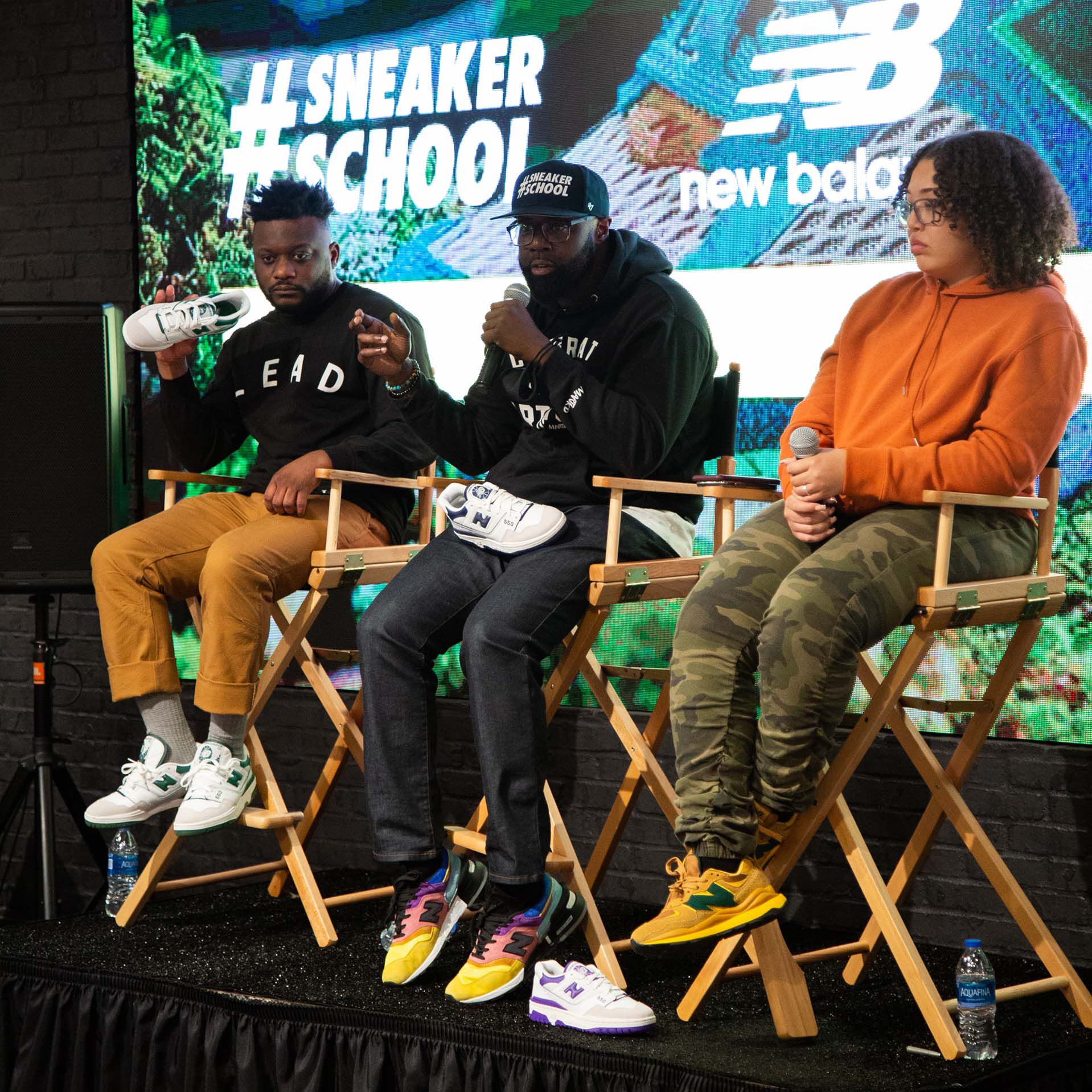 Group of 3 experts on stage at New Balance sneaker school event